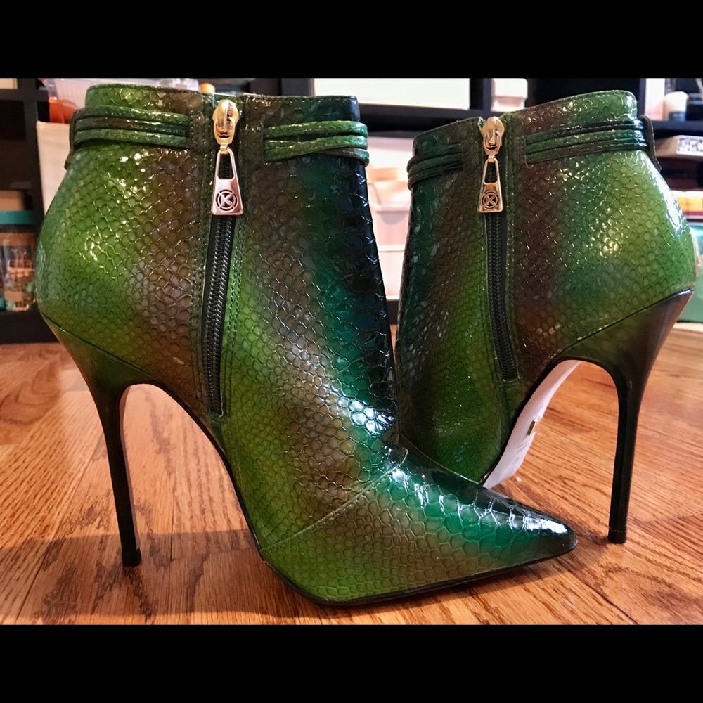 Brand New! Snake print patent leather ankle boots.